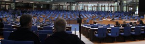 Security staff of the conference centre guarding an empty hall as the session finished earlier than anticipated.